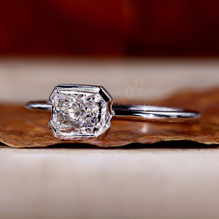 Solitaire engagement ring with a radiant cut diamond, crafted as a unique diamondrensu UK engagement ring.
