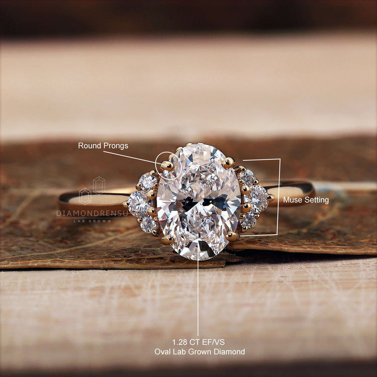 Prong ring with an oval centre stone and round side stones, an elegant engagement ring for women.
