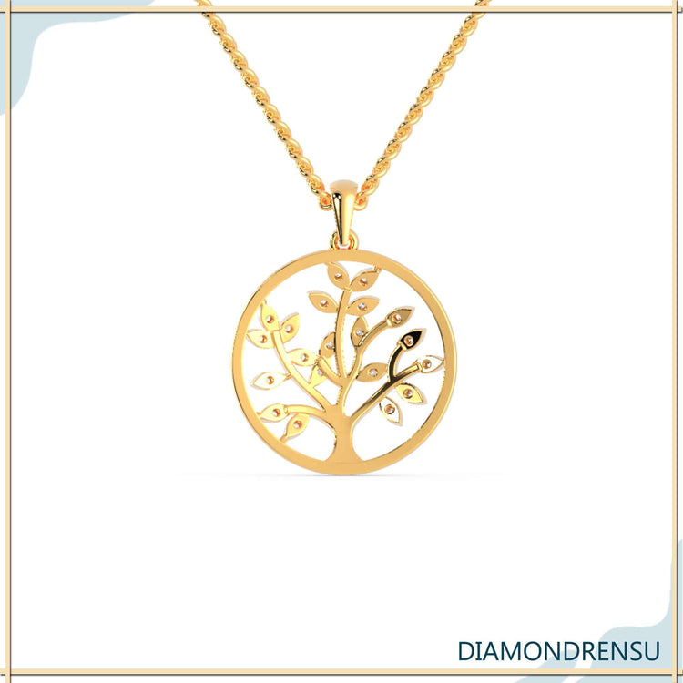 Gold diamond pendant showcasing the tree of life in detail.
