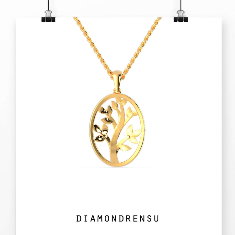 Handmade pendant with tree of life motif and gold prong setting.
