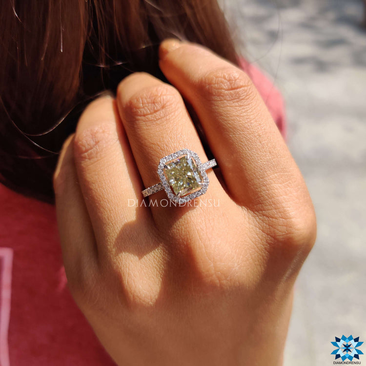Radiant cut moissanite ring in white gold with halo and hidden halo setting.
