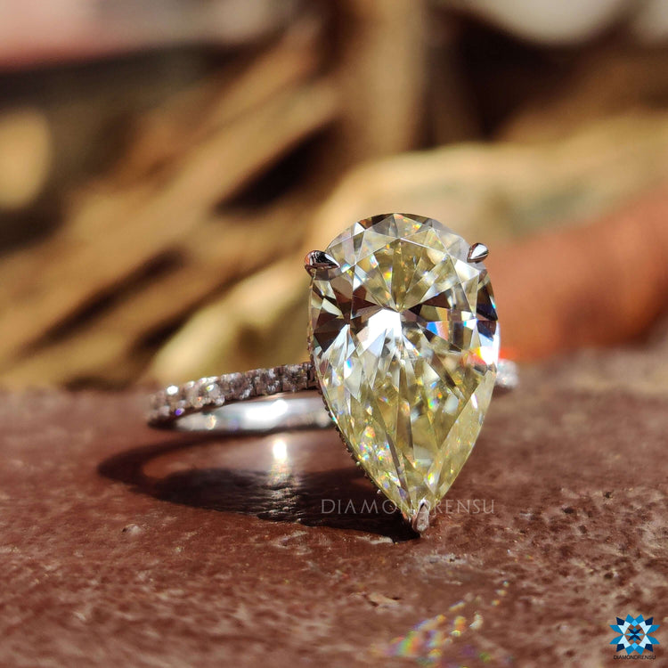Handmade pear shaped ring with 3 claw prong setting and hidden halo.

