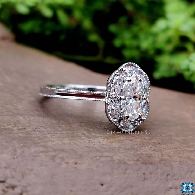 Milgrain detailed cluster ring with marquise and round stones.
