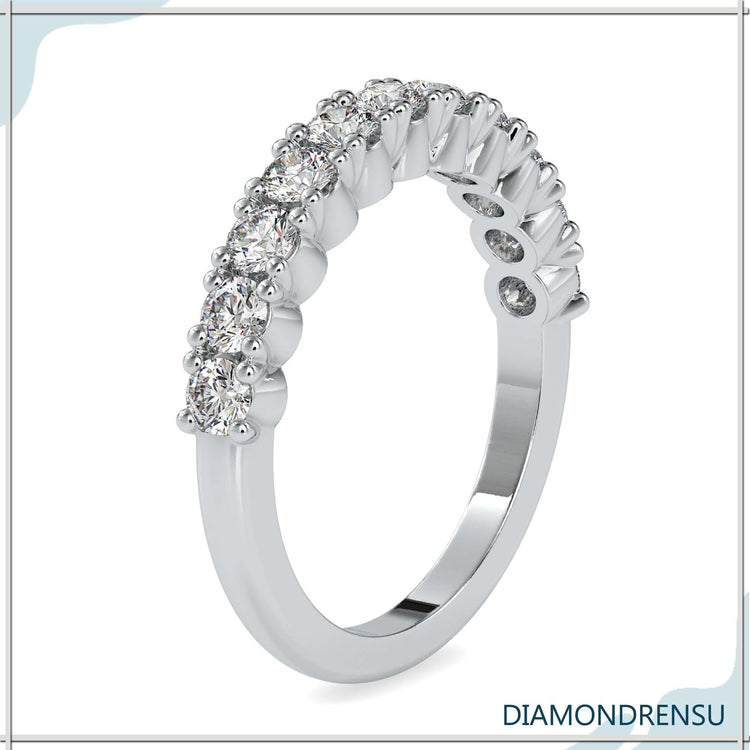 Rose gold wedding band with round cut half eternity design.
