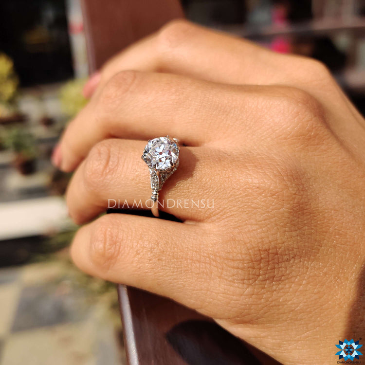 Claw prong ring with a vintage gold engagement ring for timeless elegance.
