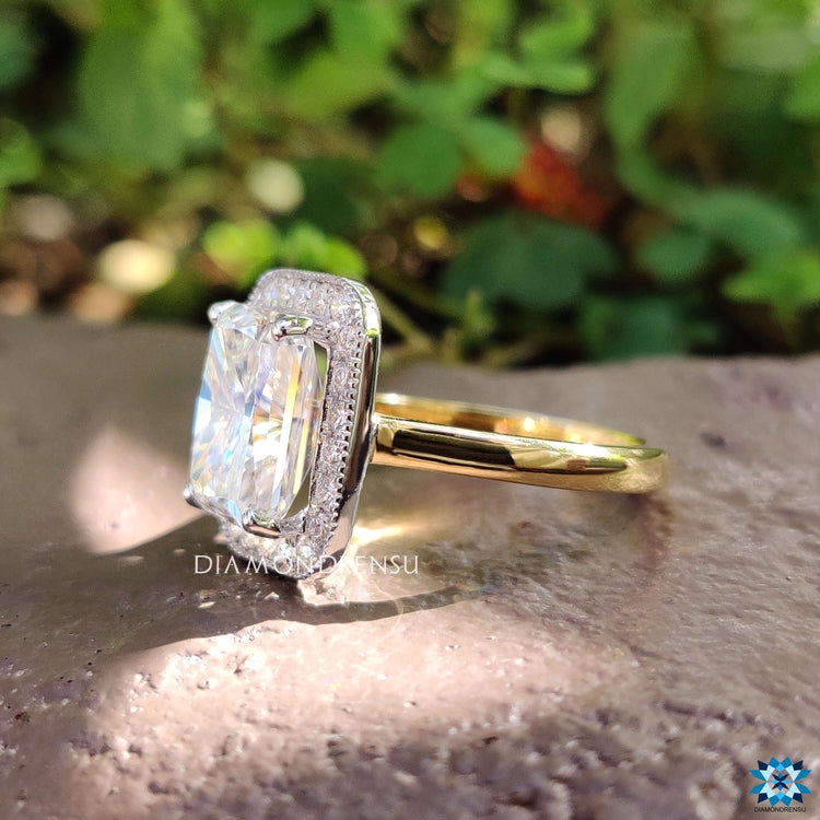 Yellow gold radiant engagement ring with milgrain detailing.
