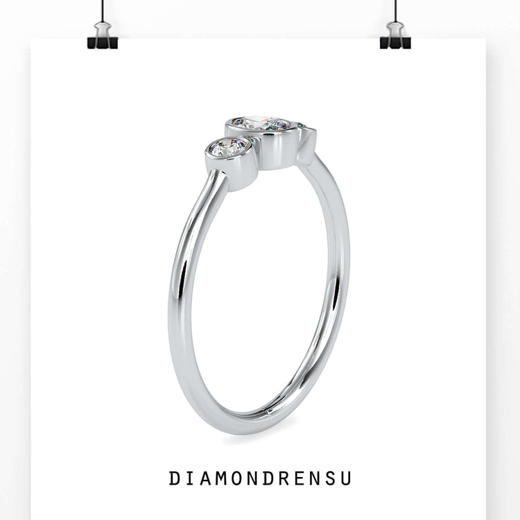 Buy engagement ring with oval diamond centre and two side stones.
