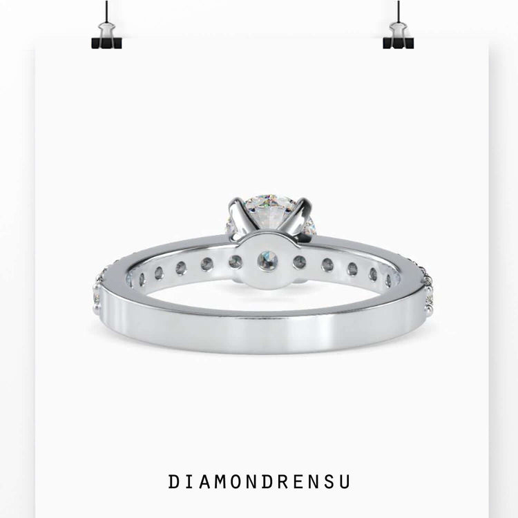 Tab prong setting ring with custom round cut design.
