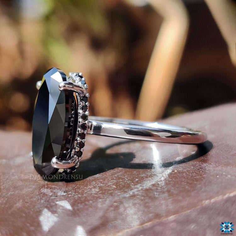 White gold moissanite ring with 4 prong setting.
