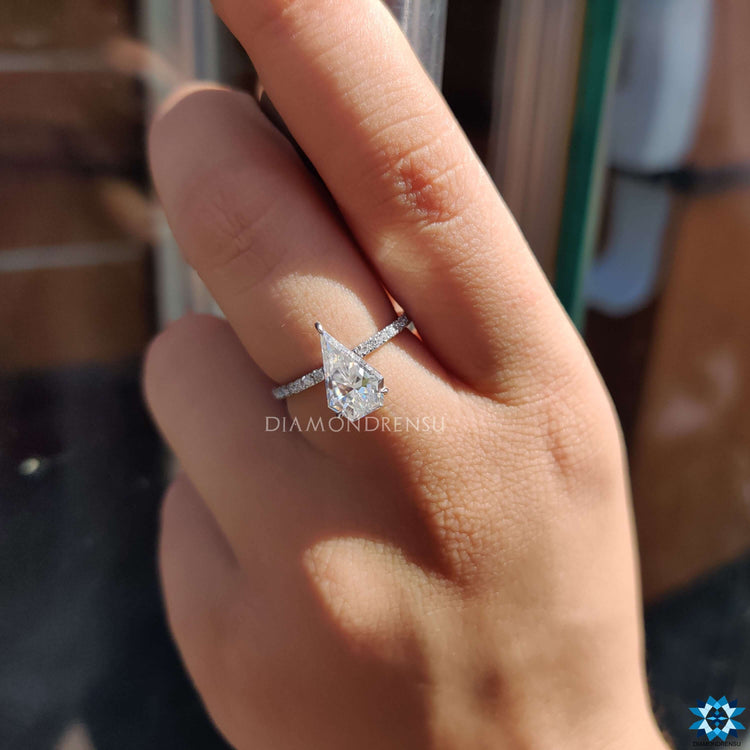 Buy moissanite ring with white gold and pave detailing.
