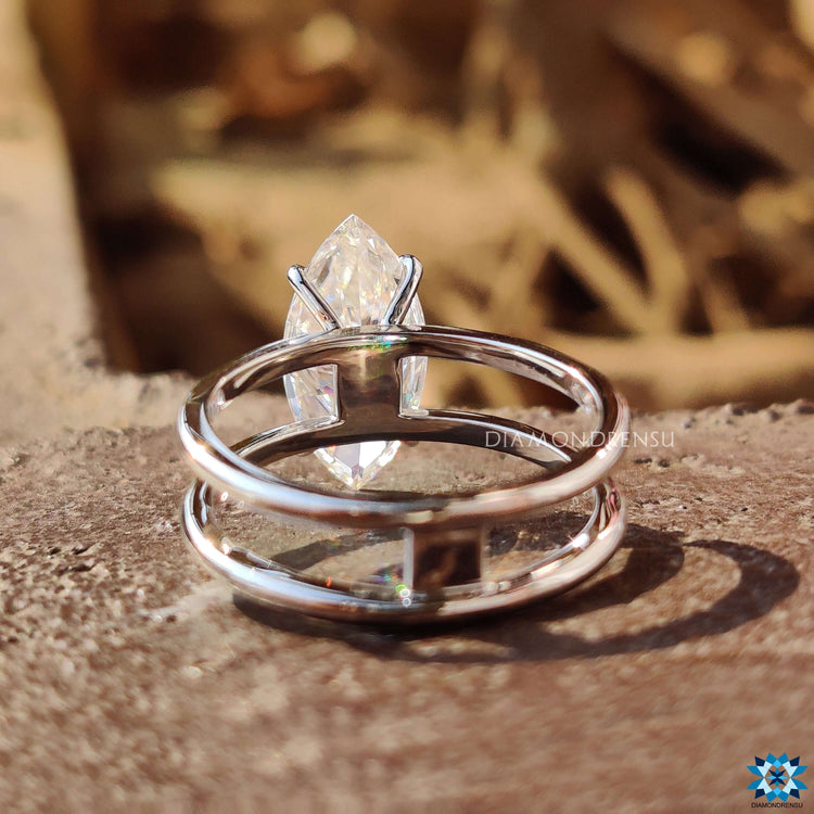 Handmade marquise solitaire ring crafted in white gold.
