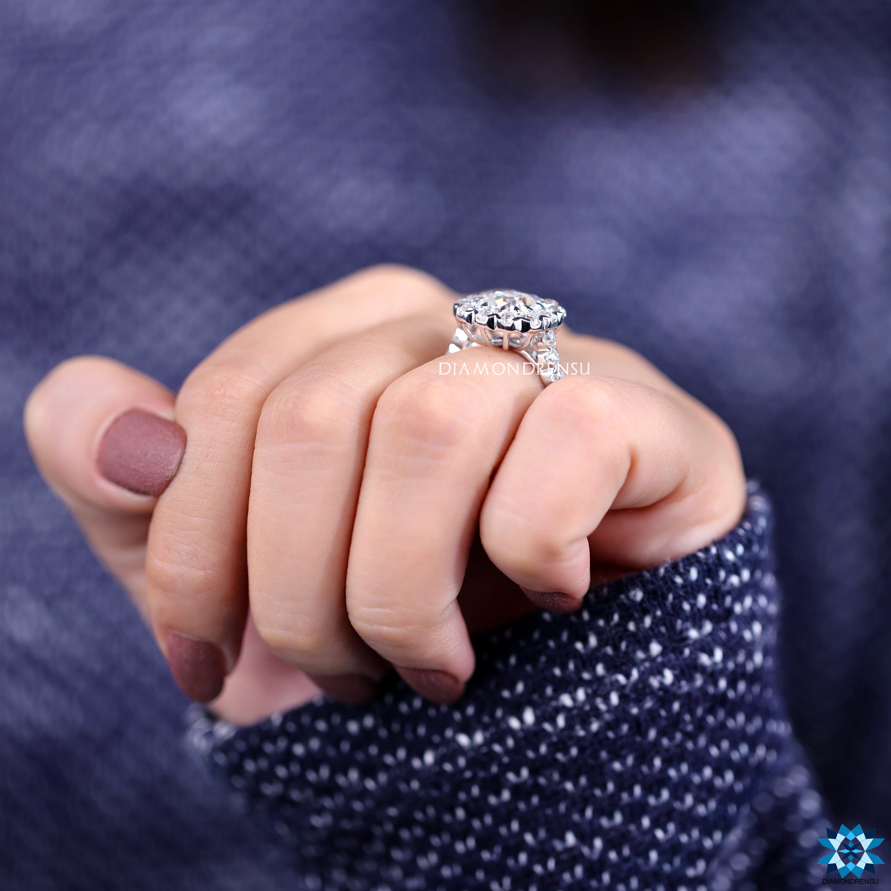 Claw prong setting ring with old mine cut and halo design.
