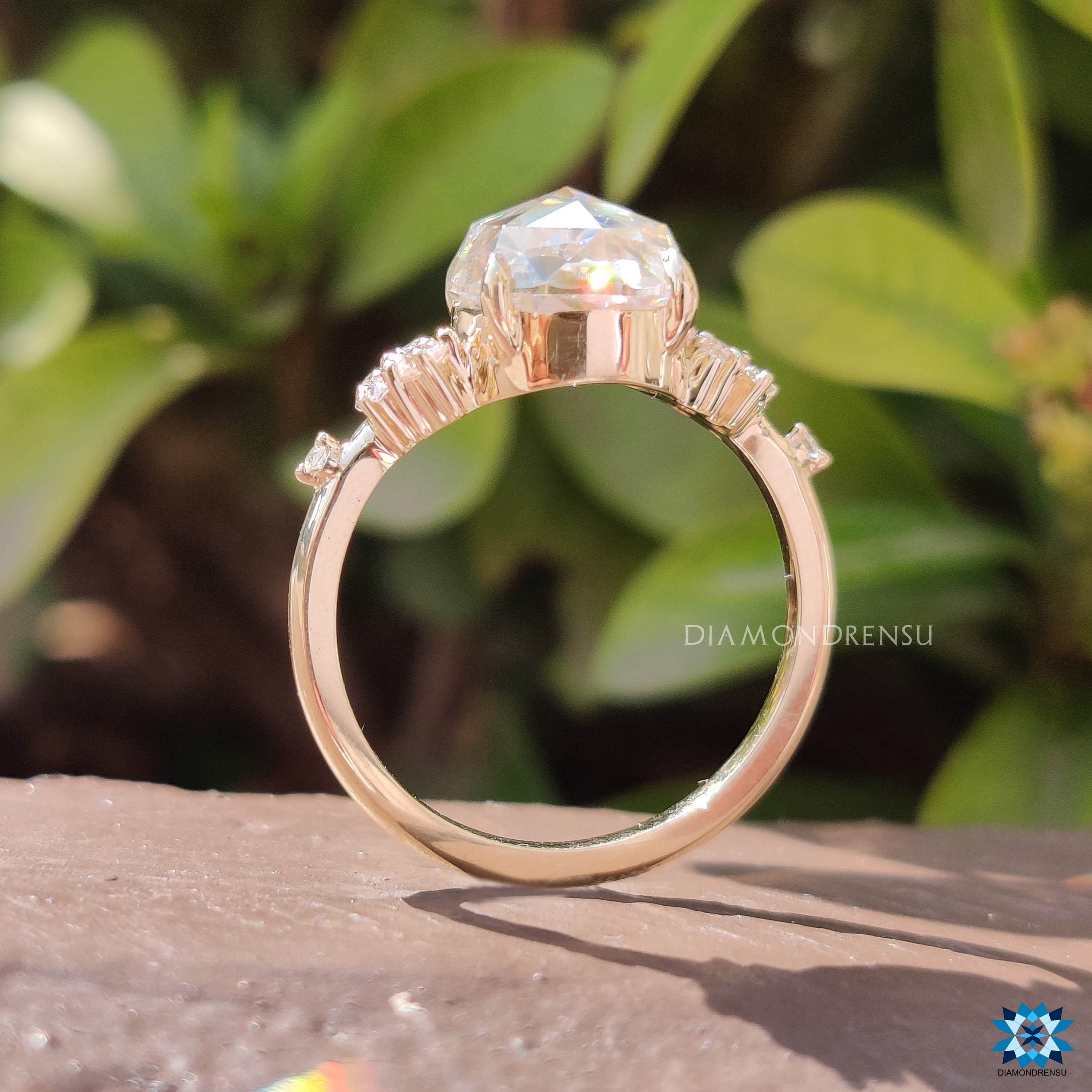 Diamondrensu UK engagement ring designed with claw prong and rose cut stone.
