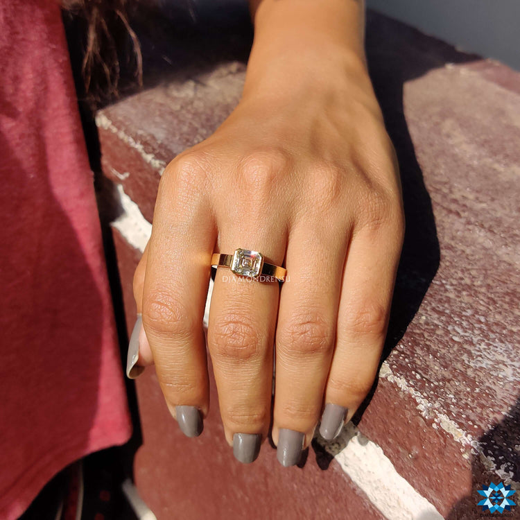 Half bezel setting on Asscher cut moissanite ring.
