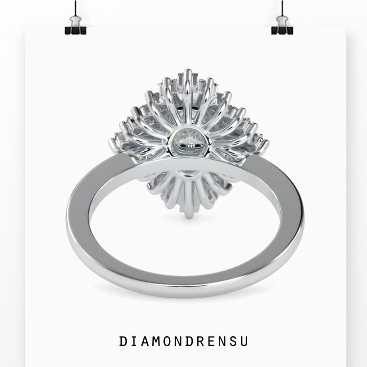 Rose gold ring featuring oval centre and halo design.
