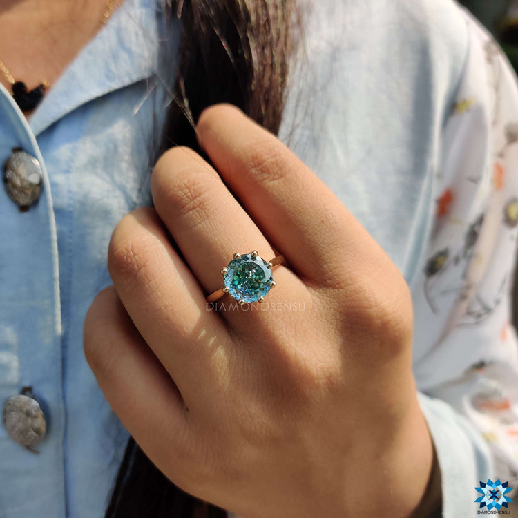 Custom moissanite ring with a cathedral mount.
