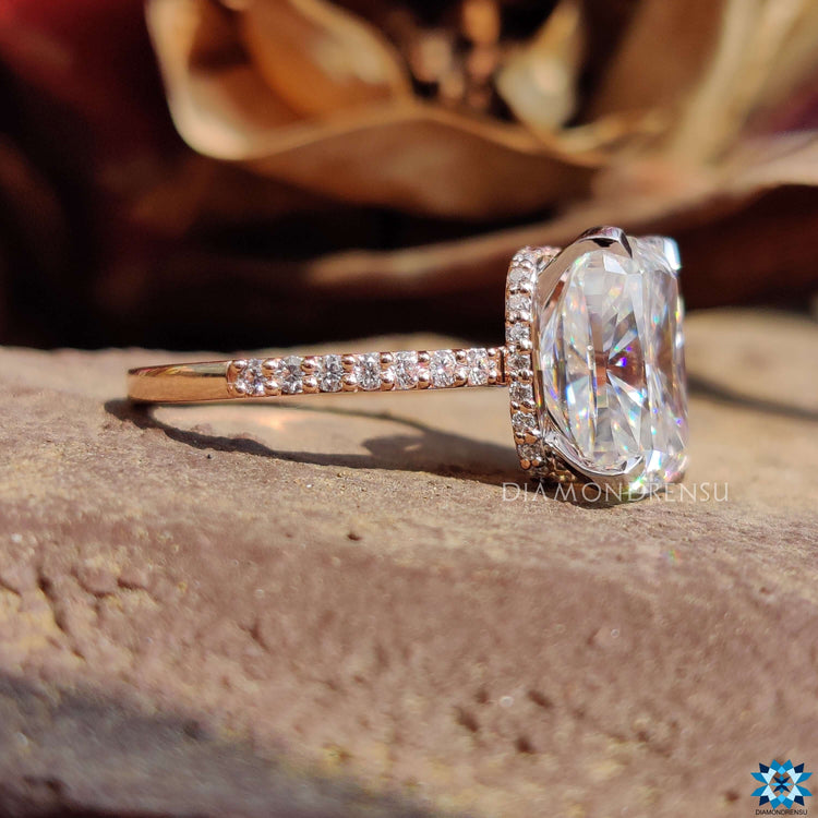 Custom moissanite ring with 4 claw prong and hidden halo.
