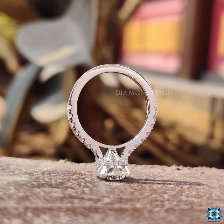 Round cut pave band on engagement ring.
