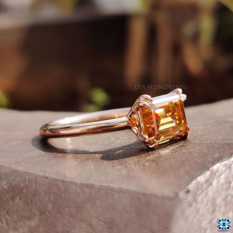 Solitaire setting ring with emerald cut center.
