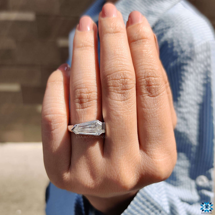 Custom engagement ring with unique shield cut design.
