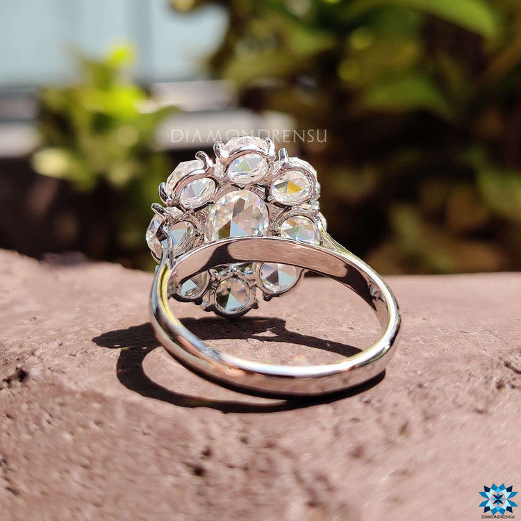 White gold moissanite ring featuring rose cut oval center.
