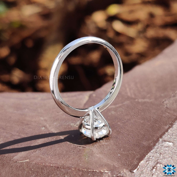 Handmade oval cut moissanite ring set in a minimalist prong setting.
