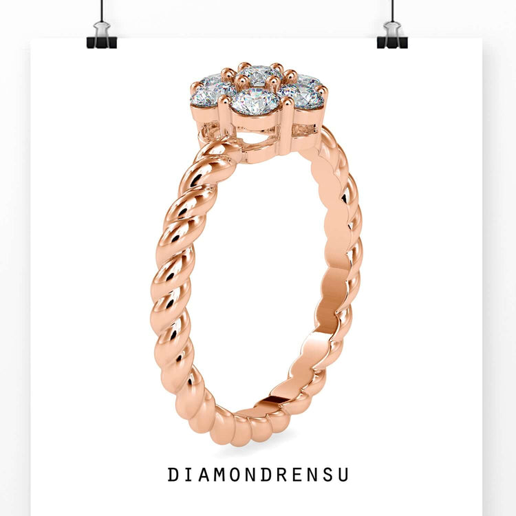 Cluster halo ring in yellow gold featuring round cut diamond.
