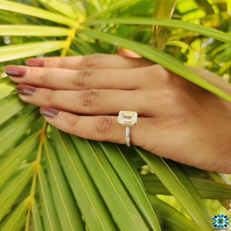 Custom engagement ring with channel setting and hidden halo in gold.
