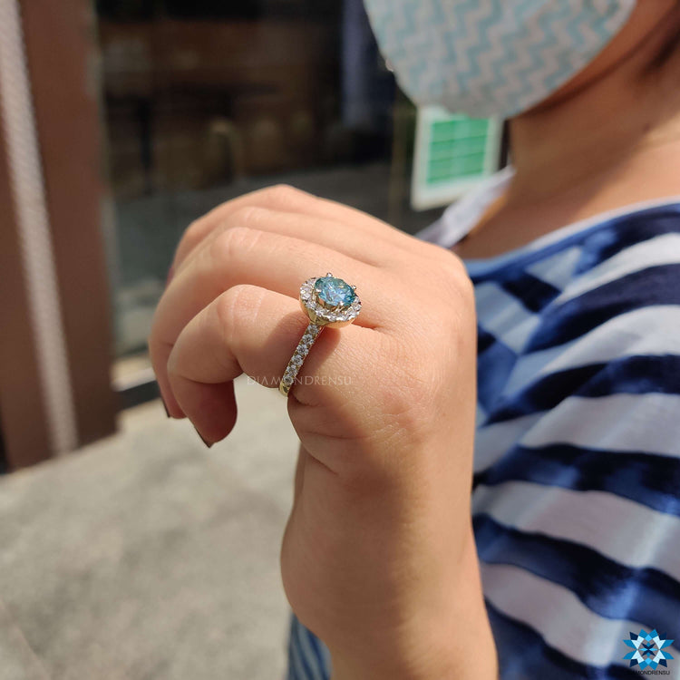 Handmade round moissanite ring with halo design.
