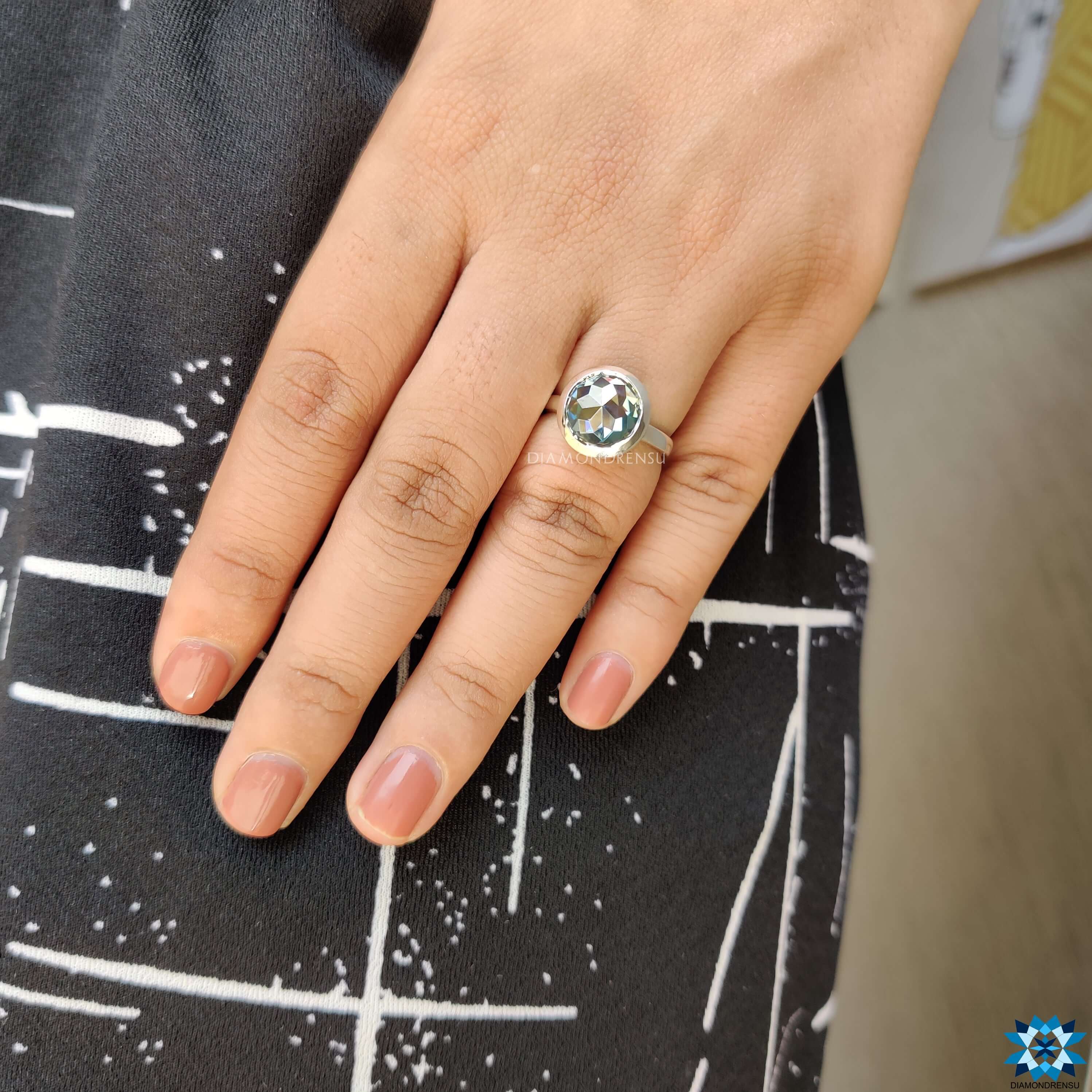 A beautiful moissanite engagement ring with a handcrafted design, emphasizing elegance and style.
