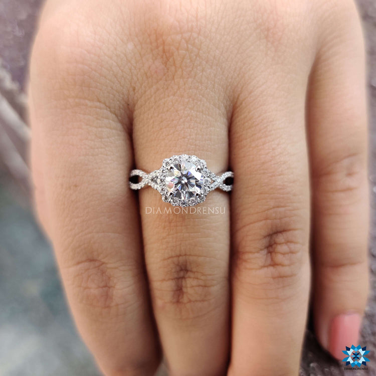 Handmade white gold ring with round cut moissanite.
