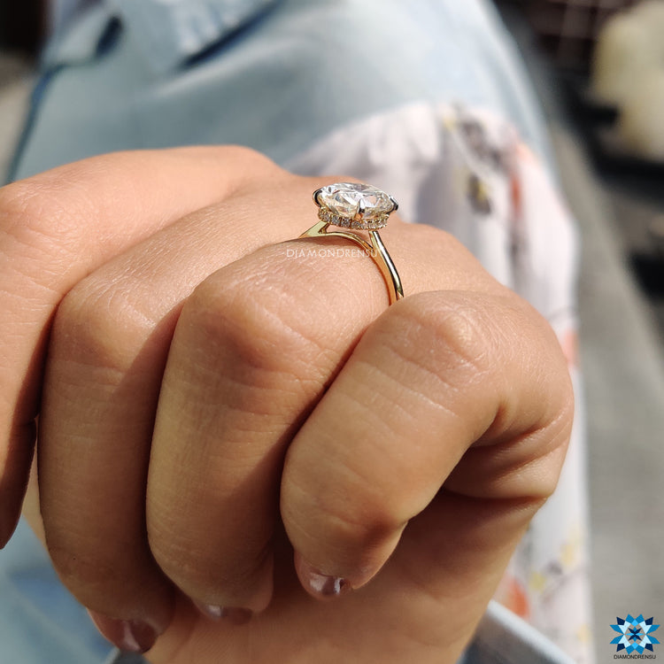 Moissanite for engagement ring with hidden halo and round cut style.
