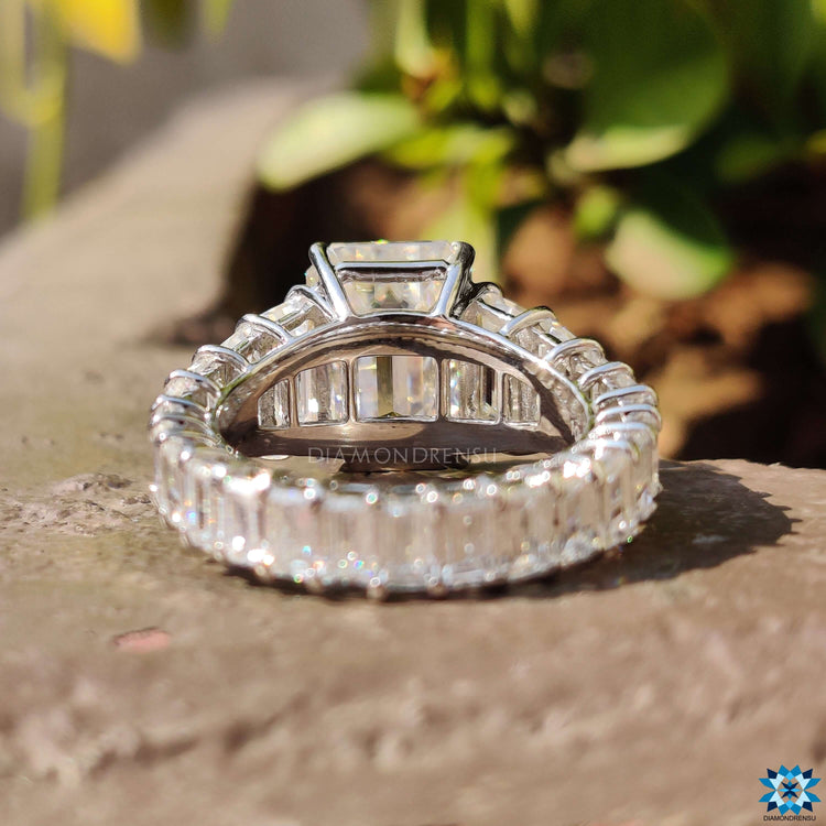 4 prong emerald moissanite ring with vintage style details.
