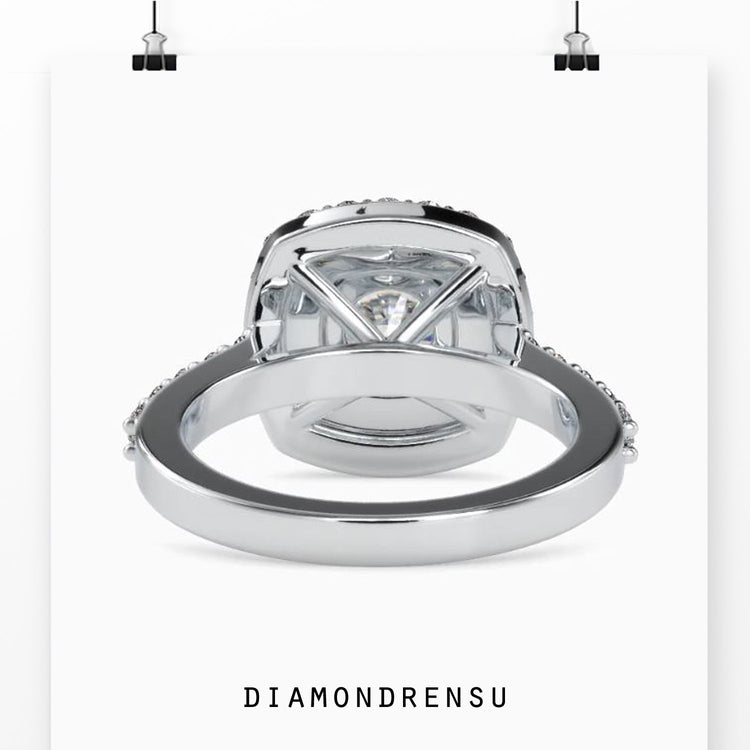 Simple diamond ring with round cut and halo setting.
