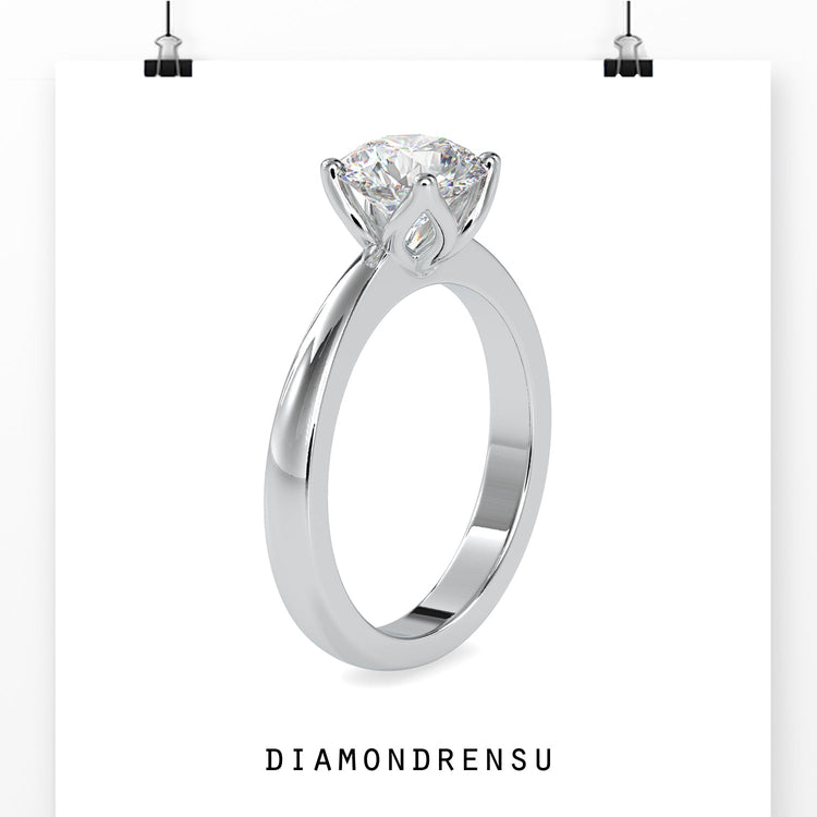 Solitaire setting ring in rose gold with tapered shank.
