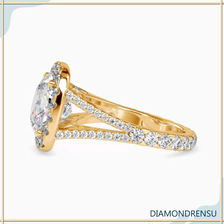 Yellow gold engagement ring with pave round cut band.
