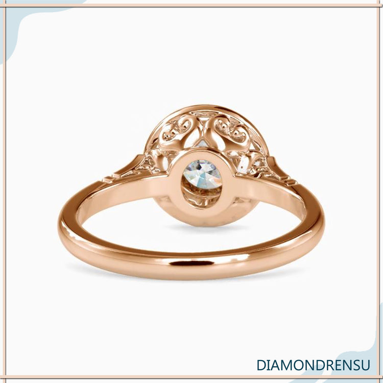 Bezel solitaire ring in rose gold with round cut diamond.
