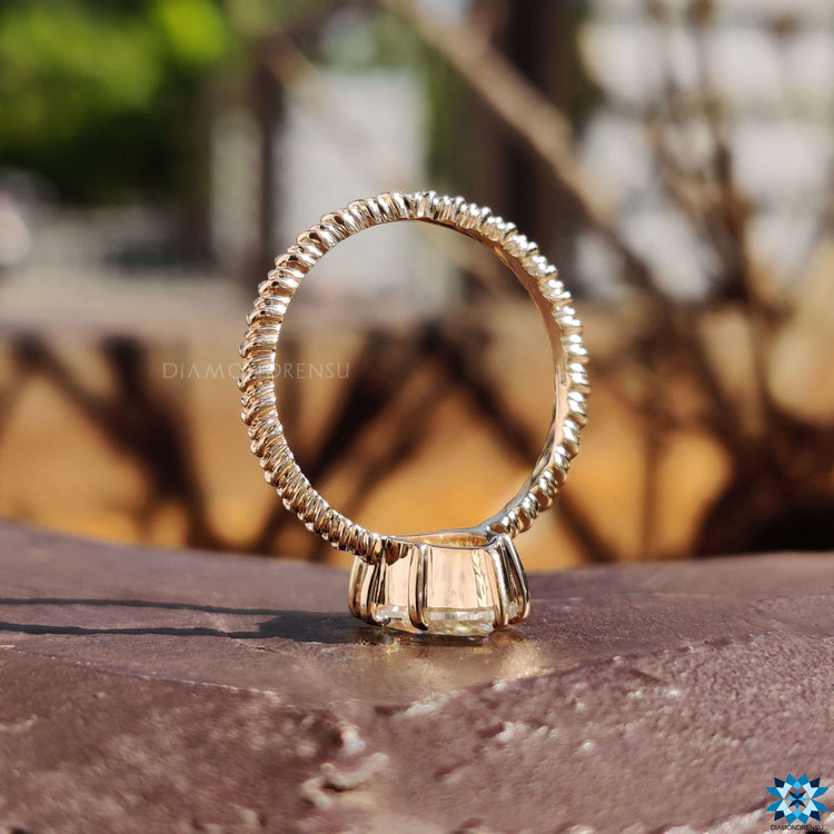 Yellow gold moissanite ring in solitaire style.
