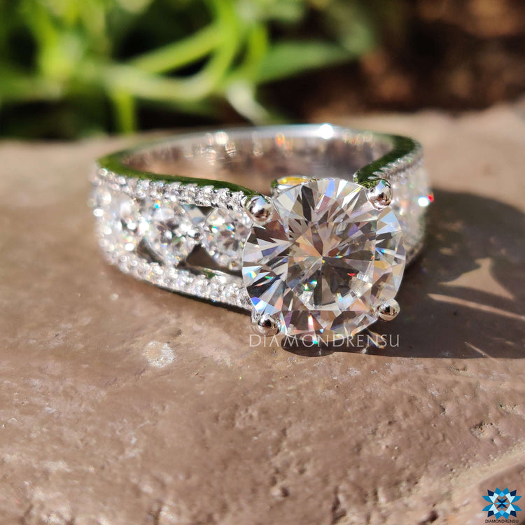 Bubble prong set round moissanite ring in white gold.
