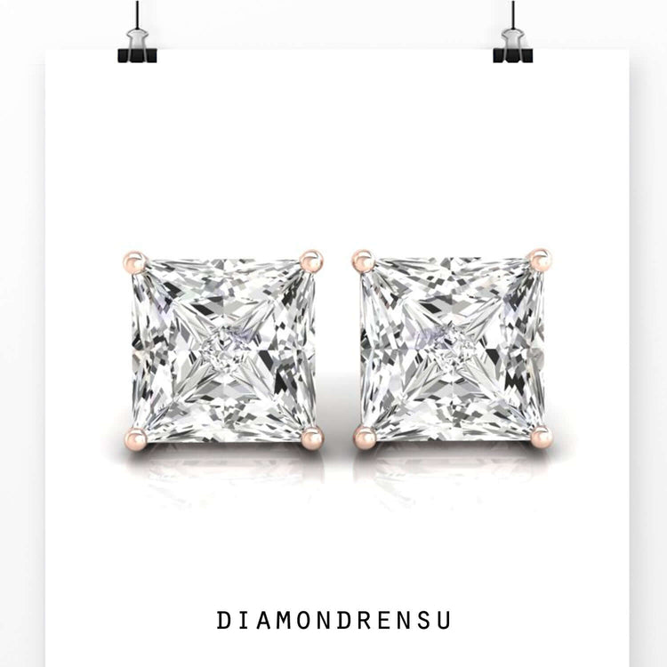 Rose gold princess cut diamond stud earrings with secure prong setting.
