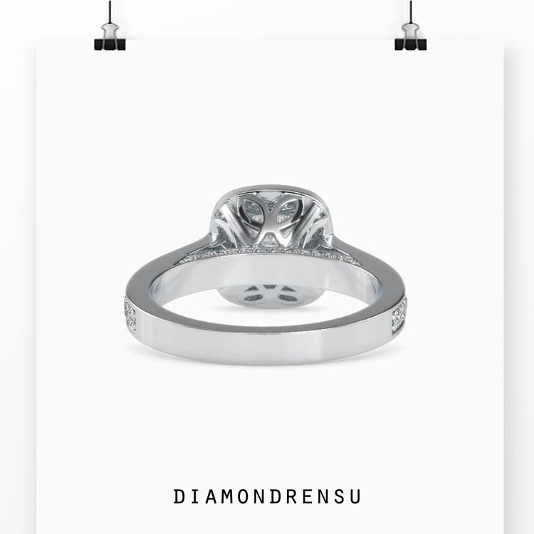 Rose gold ring featuring cathedral setting and pave accents.
