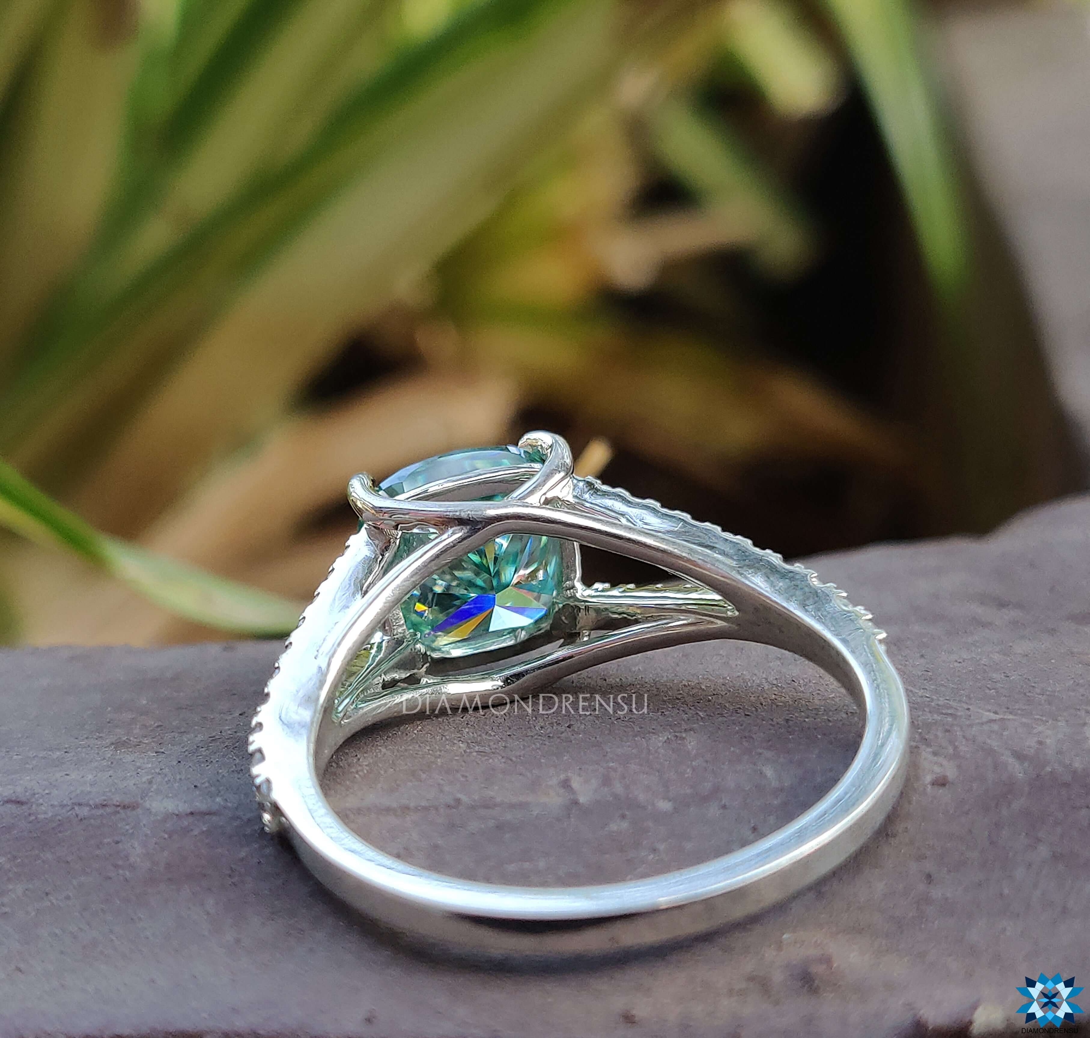 Prong setting ring with a beautiful moissanite centre in a split shank design.