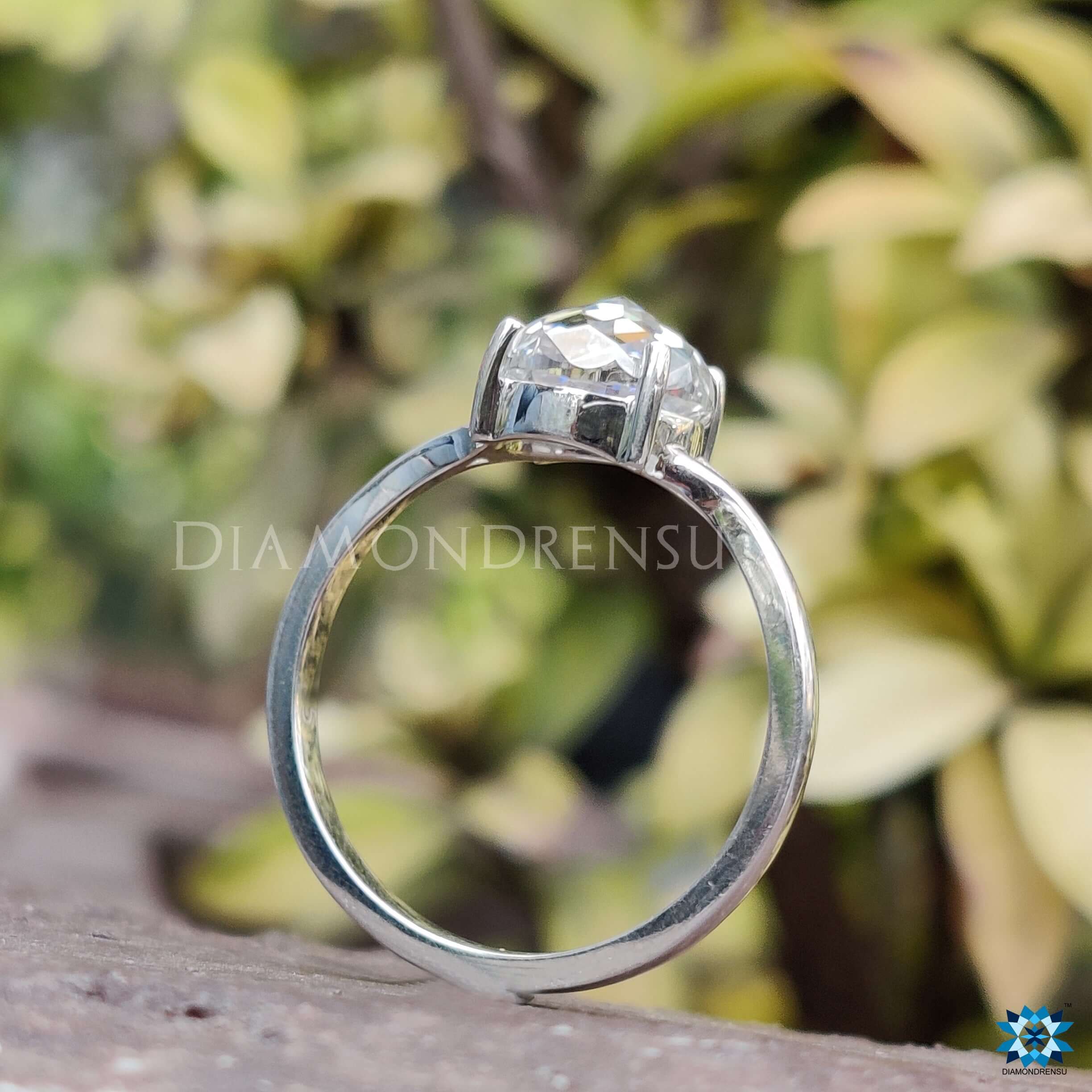 White gold moissanite ring with a rose cut diamond ring for extra brilliance.