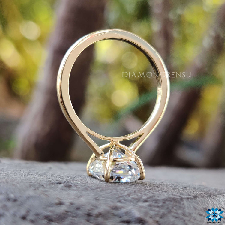 Moissanite engagement ring with a clean, minimalist design.
