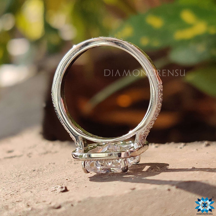 Radiant moissanite center with 4 prong setting.
