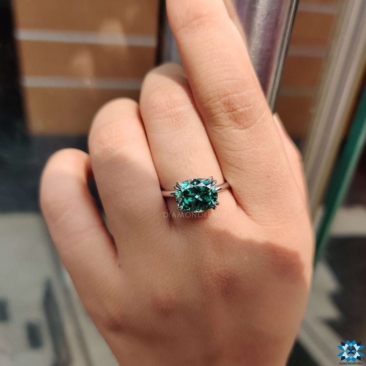 East west set moissanite ring in white gold.
