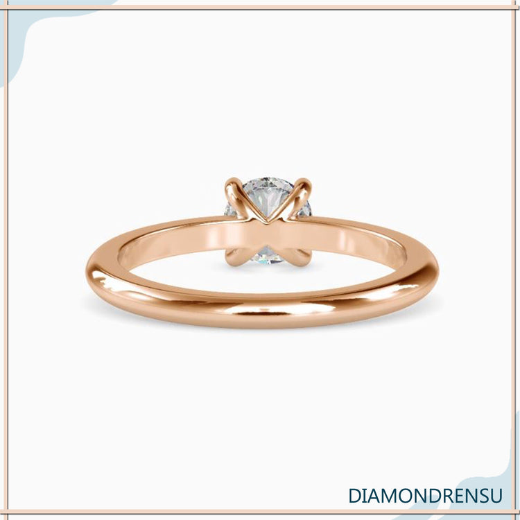 UK engagement ring with gold solitaire and handmade mount.
