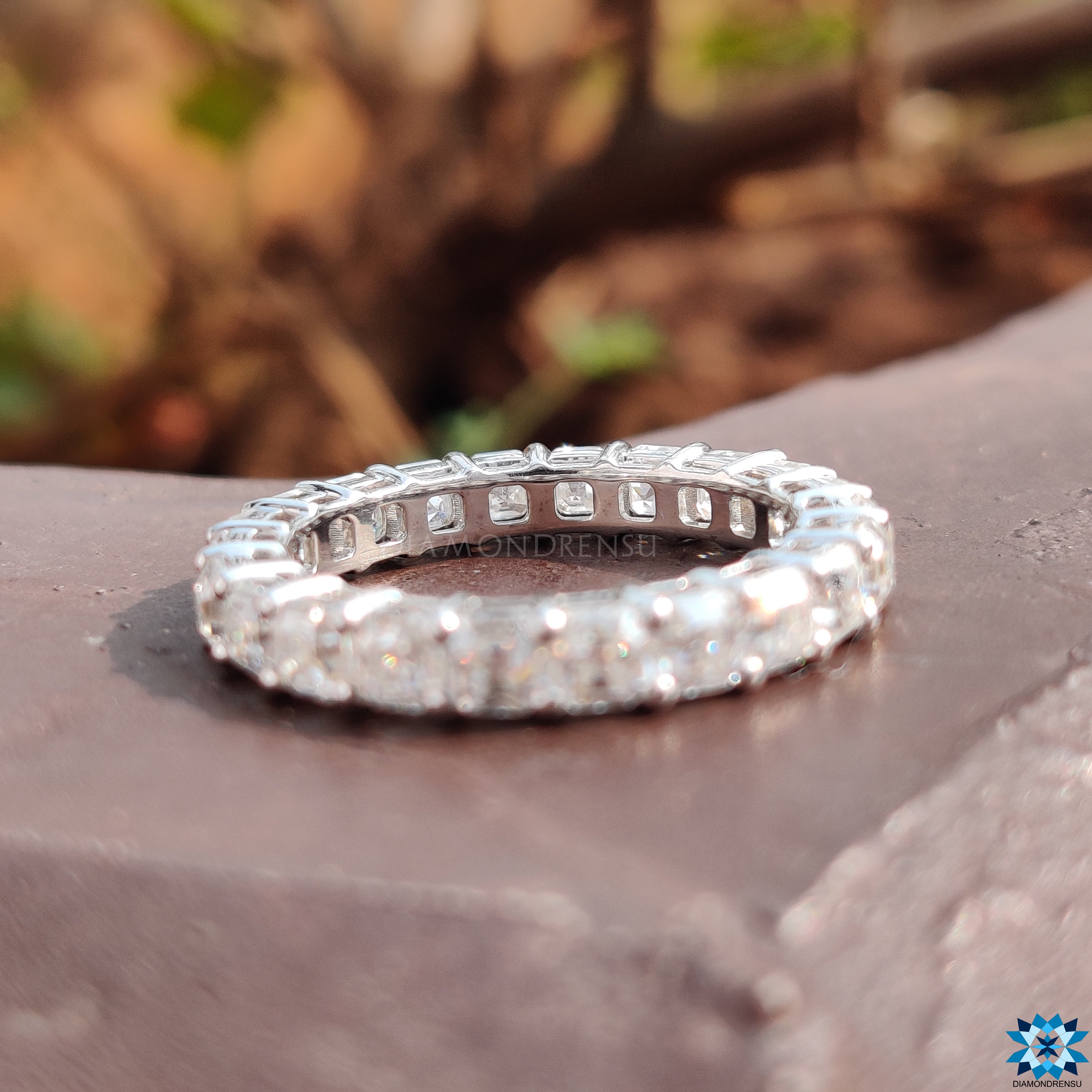 Shared prong wedding band for a sleek, modern aesthetic.