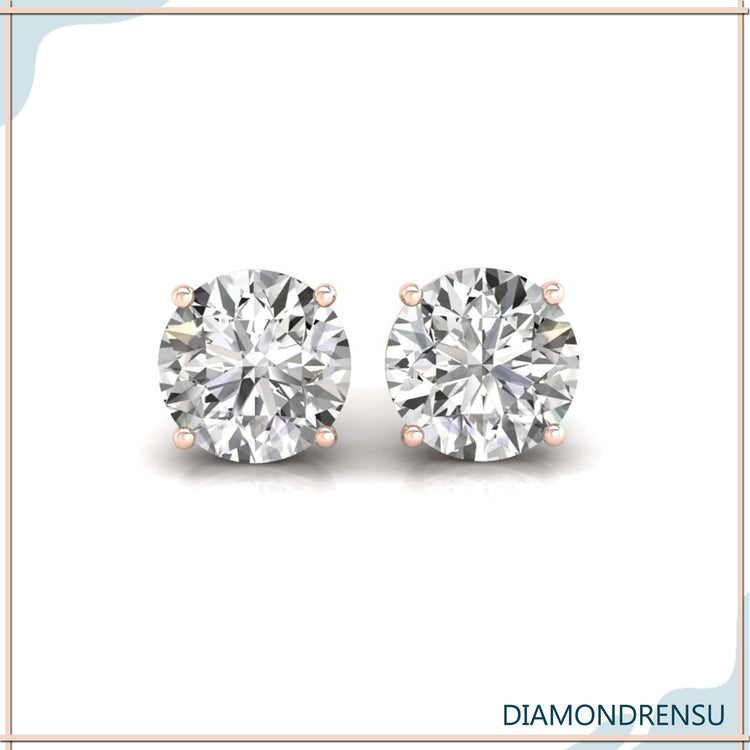 Screw back earrings with round diamond centre stones.
