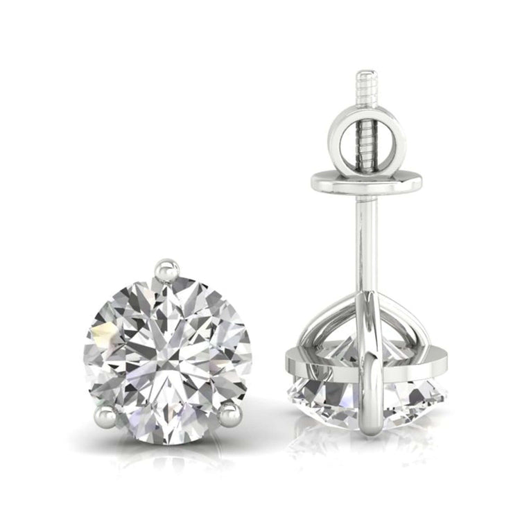 Round cut diamond stud earrings in white gold.
